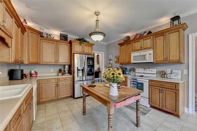 kitchen featuring white appliances, crown molding, light tile patterned floors, and hanging light fixtures