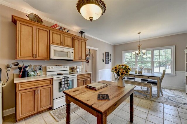 kitchen with ornamental molding, a notable chandelier, decorative light fixtures, light tile patterned floors, and white appliances