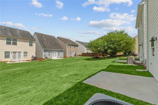 170 Chandler Trce, Covington, GA 30016 - view of grassy yard with cooling unit, a patio, and a residential view