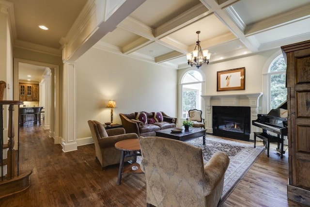 5284 Vernon Springs Trl, Sandy Springs, GA 30327 - living room with plenty of natural light, dark wood finished floors, beam ceiling, a glass covered fireplace, and baseboards