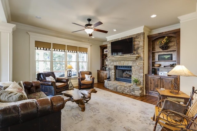 5284 Vernon Springs Trl, Sandy Springs, GA 30327 - living room featuring ceiling fan, a fireplace, wood finished floors, ornamental molding, and recessed lighting