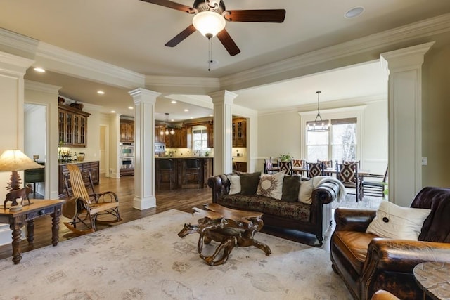 5284 Vernon Springs Trl, Sandy Springs, GA 30327 - living area featuring ornate columns, healthy amount of natural light, ceiling fan, wood finished floors, and crown molding