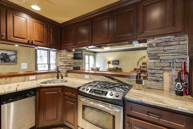 5284 Vernon Springs Trl, Sandy Springs, GA 30327 - kitchen featuring stainless steel appliances, a sink, light stone countertops, a stone fireplace, and under cabinet range hood