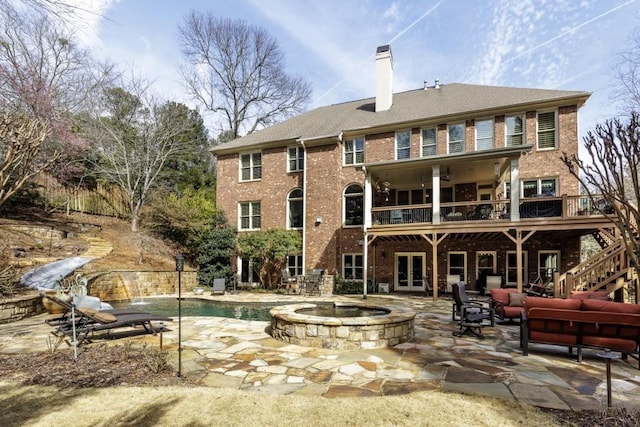 5284 Vernon Springs Trl, Sandy Springs, GA 30327 - rear view of house featuring brick siding, a patio, a chimney, a deck, and stairs