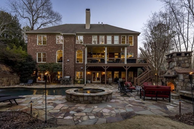 5284 Vernon Springs Trl, Sandy Springs, GA 30327 - back of property with a patio, a chimney, stairway, an outdoor pool, and brick siding