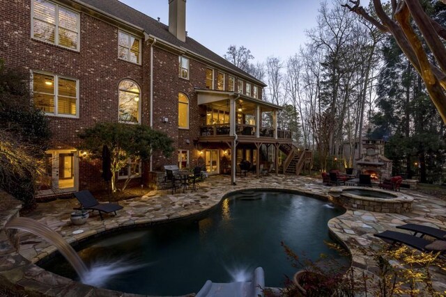 5284 Vernon Springs Trl, Sandy Springs, GA 30327 - back of property with stairs, a chimney, a patio, and brick siding