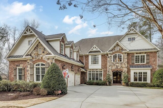 5284 Vernon Springs Trl, Sandy Springs, GA 30327 - view of front of house featuring driveway, brick siding, and a garage