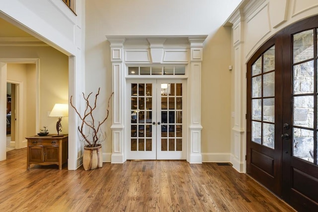 5284 Vernon Springs Trl, Sandy Springs, GA 30327 - entrance foyer with french doors, wood finished floors, ornamental molding, and baseboards