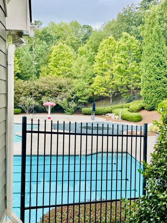 view of pool featuring fence and a fenced in pool