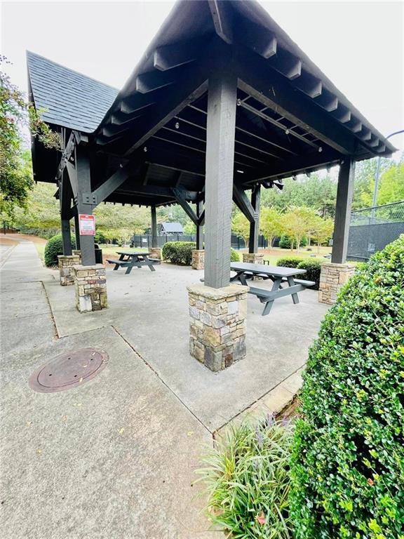 surrounding community with a gazebo and a patio area