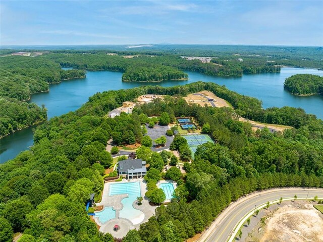 bird's eye view featuring a water view and a wooded view