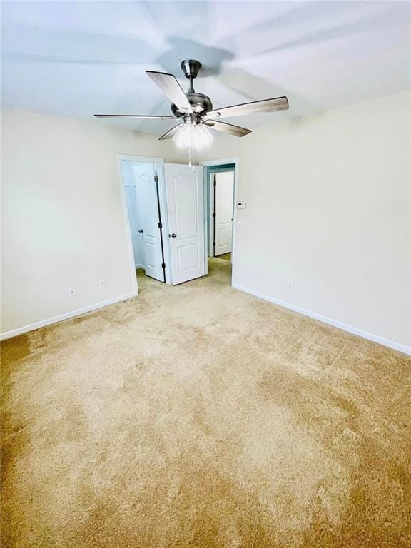306 Mountain Laurel Walk, Canton, GA 30114 - spare room featuring a ceiling fan, baseboards, and light carpet