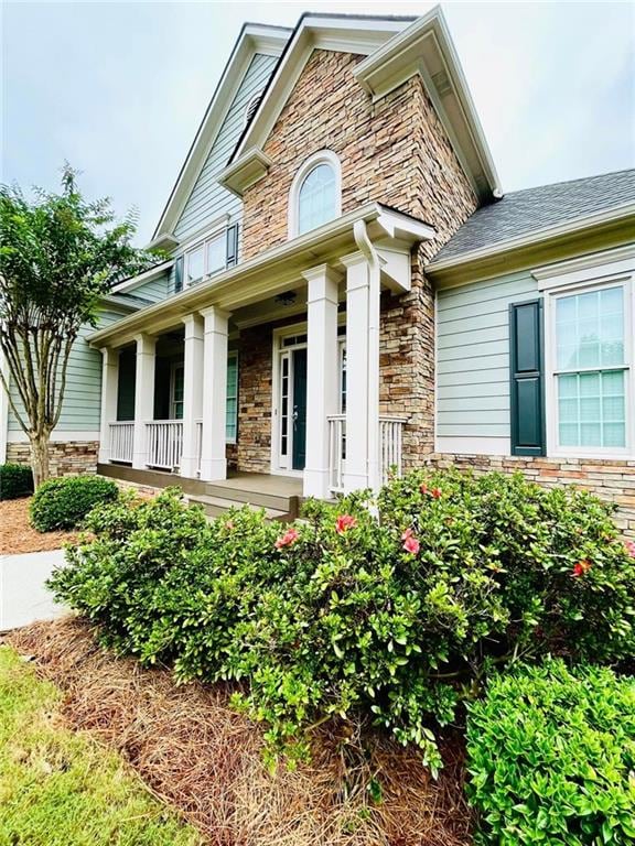 306 Mountain Laurel Walk, Canton, GA 30114 - view of front of property with stone siding and covered porch