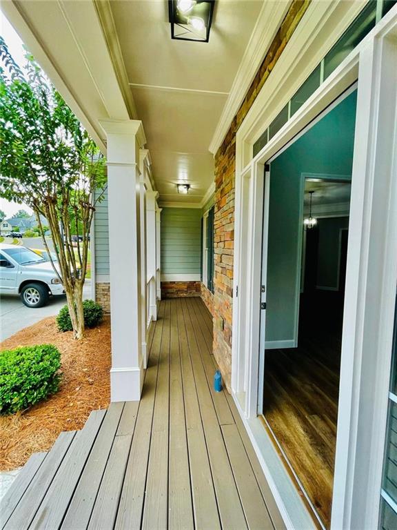 wooden deck featuring covered porch