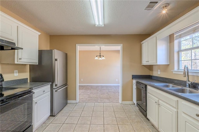 kitchen with light tile patterned flooring, sink, white cabinets, black appliances, and a textured ceiling