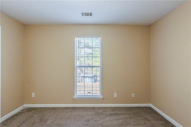 empty room with carpet flooring