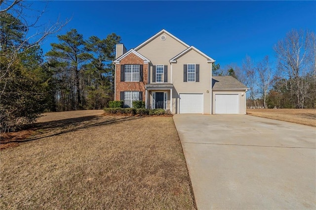 view of front property with a garage and a front lawn