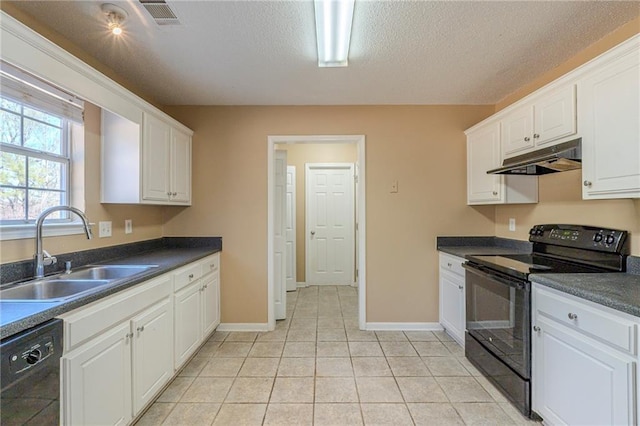 kitchen featuring sink, light tile patterned floors, black appliances, a textured ceiling, and white cabinets