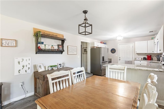 dining area featuring baseboards