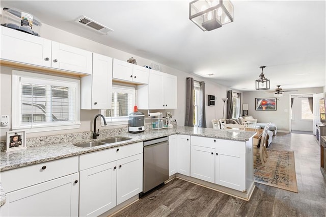 kitchen featuring a ceiling fan, visible vents, a peninsula, a sink, and dishwasher