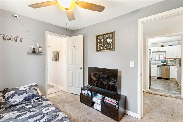 bedroom with baseboards, light carpet, and a ceiling fan