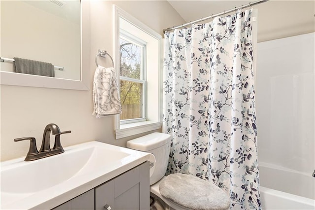 full bath featuring vanity, toilet, and shower / bath combo with shower curtain