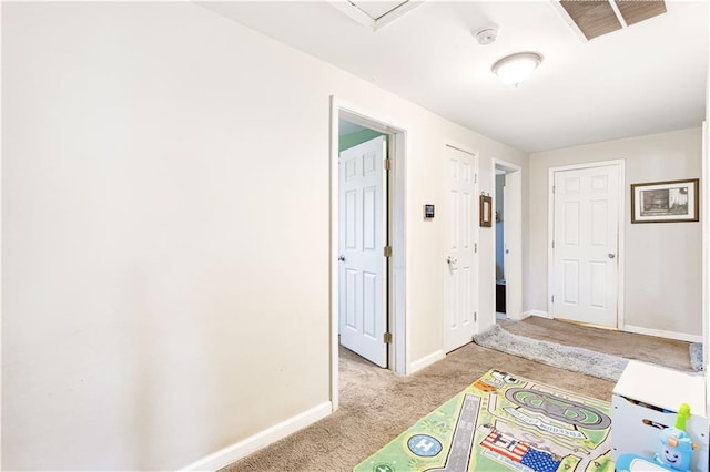 recreation room with visible vents, baseboards, and light colored carpet