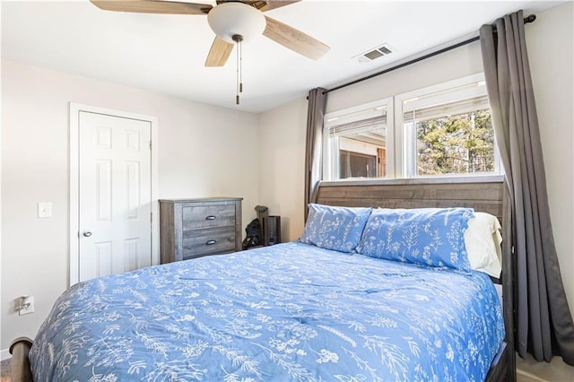 bedroom featuring visible vents and ceiling fan