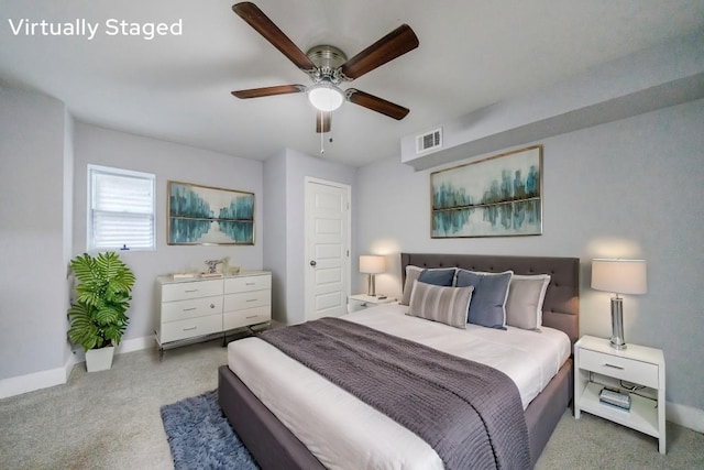 bedroom with ceiling fan and light carpet