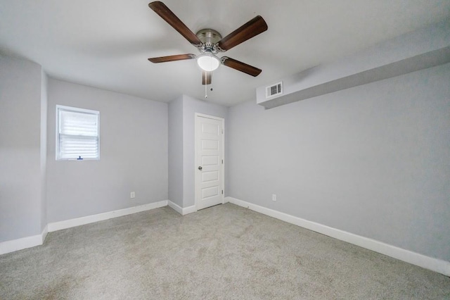 unfurnished bedroom featuring light carpet and ceiling fan