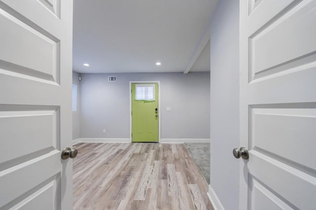 foyer entrance with light hardwood / wood-style flooring