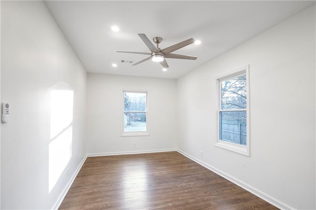 4605 Doss Cir, Powder Springs, GA 30127 - spare room featuring baseboards, a ceiling fan, dark wood finished floors, and visible vents