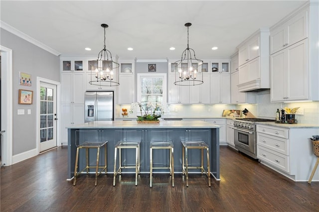 kitchen featuring a center island, hanging light fixtures, and stainless steel appliances