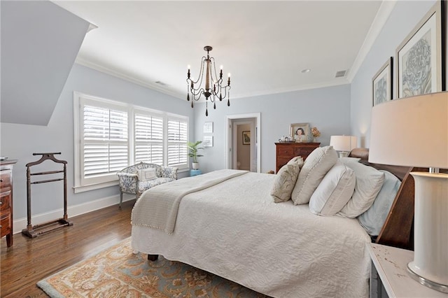 bedroom with dark hardwood / wood-style floors, an inviting chandelier, and ornamental molding