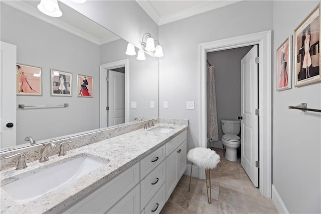 bathroom featuring tile floors, dual sinks, toilet, crown molding, and large vanity