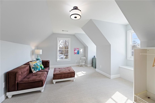 bonus room featuring light colored carpet and vaulted ceiling