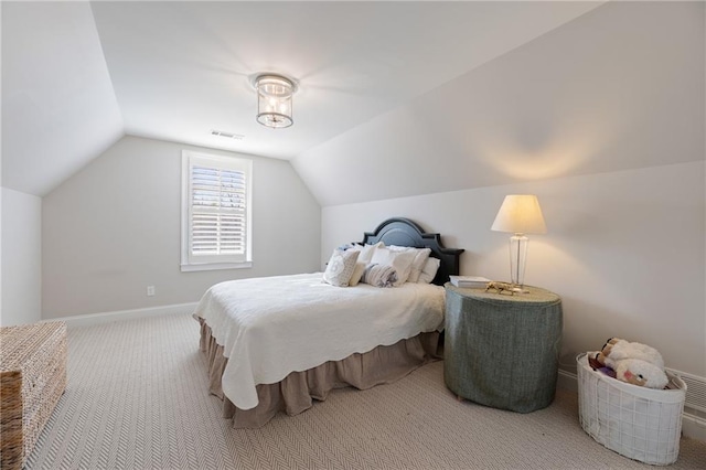 carpeted bedroom featuring vaulted ceiling