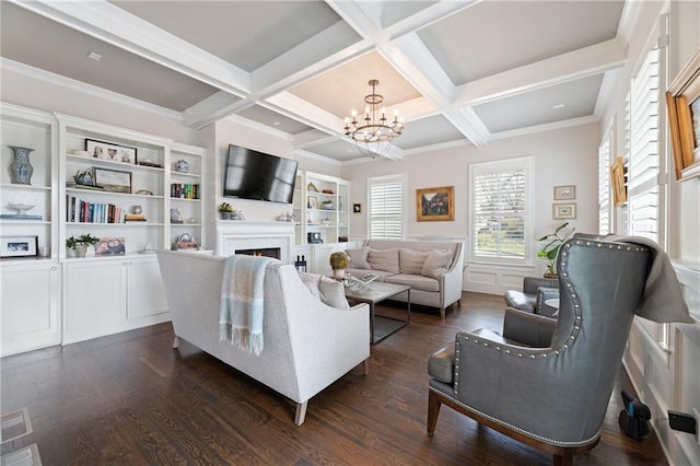 living room with coffered ceiling, dark hardwood / wood-style floors, a chandelier, and beamed ceiling