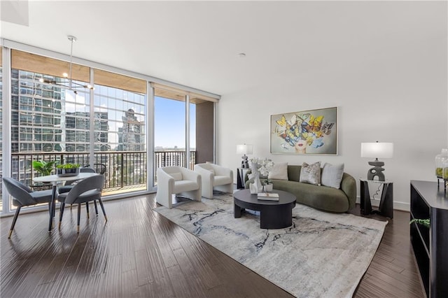 living room featuring dark hardwood / wood-style flooring and expansive windows