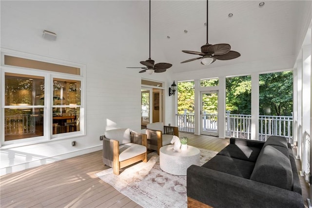 sunroom / solarium featuring ceiling fan