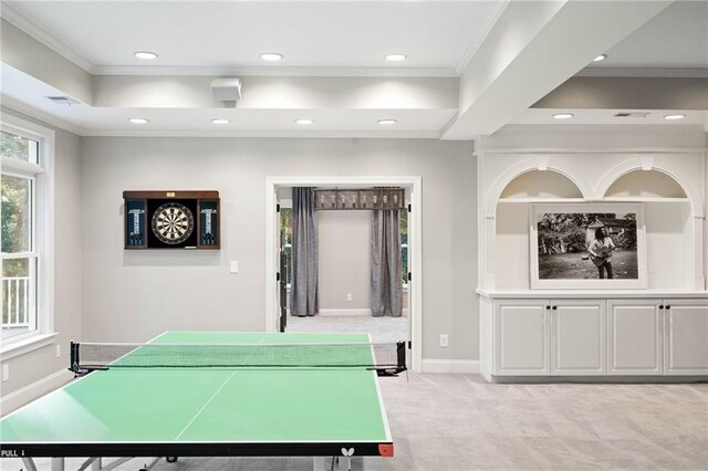 game room featuring ornamental molding and light colored carpet