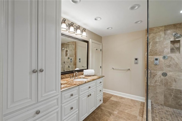 bathroom featuring tile patterned floors, vanity, and walk in shower