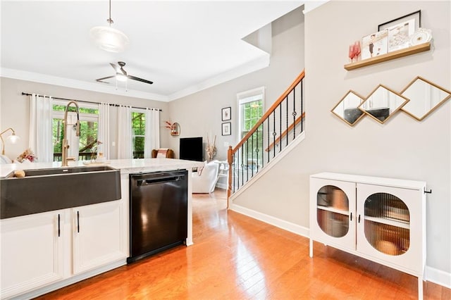 1996 Cobblestone Cir NE, Atlanta, GA 30319 - kitchen featuring dishwashing machine, a sink, ceiling fan, light wood-style floors, and open floor plan