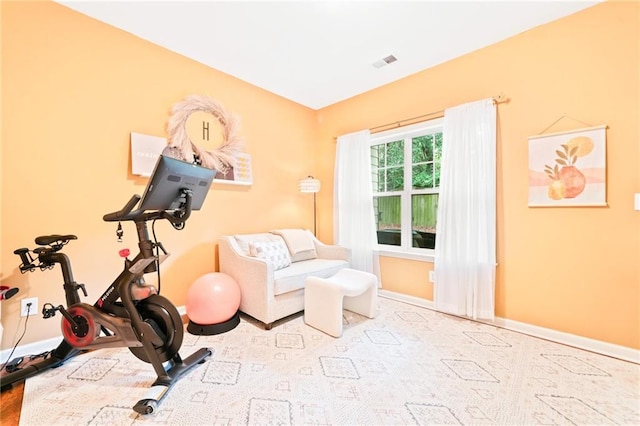 exercise room with baseboards
