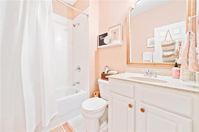 bathroom featuring toilet, vanity, tile patterned flooring, and shower / bath combo