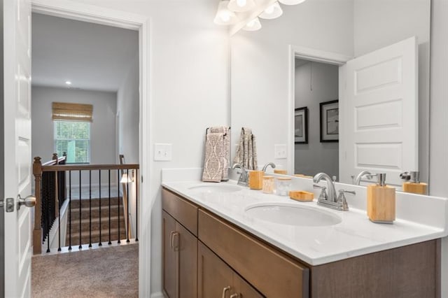 full bath with double vanity and a sink