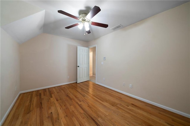 interior space with ceiling fan, lofted ceiling, and light wood-type flooring