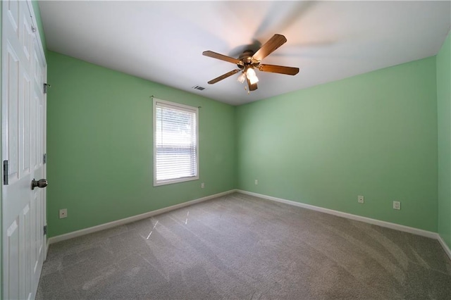 empty room featuring carpet and ceiling fan