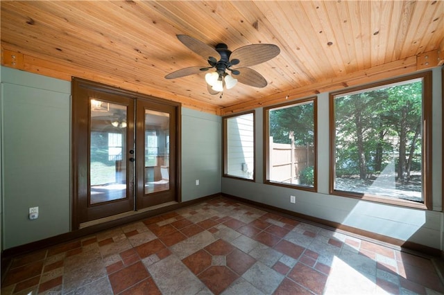 unfurnished sunroom with french doors, ceiling fan, and wood ceiling