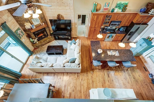 43 Morley Dr, Ellijay, GA 30540 - living area with a ceiling fan, wood finished floors, healthy amount of natural light, and a fireplace